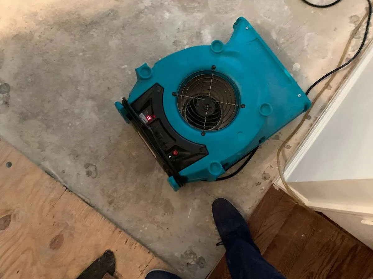 Air mover drying subfloor during Commercial Water Damage Restoration in Boulder City